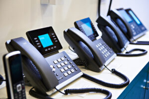 Row of telephones for what are VoIP phones